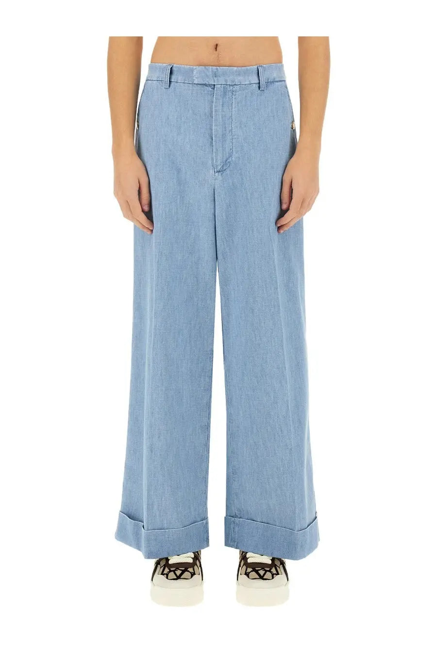 Valentino men’s denim pants in light blue with a wide-leg cut and rolled cuffs made from denim fabric