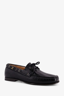 Valentino men’s black leather loafers with gold-tone lv logo hardware and lace-up detailing boat shoe design