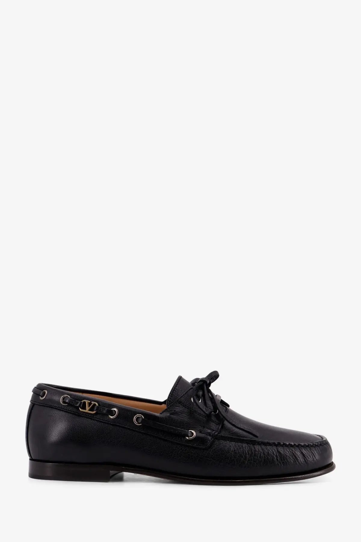 Black leather boat shoe with gold-tone Valentino logo plaque and eyelets in Valentino men’s leather loafers black