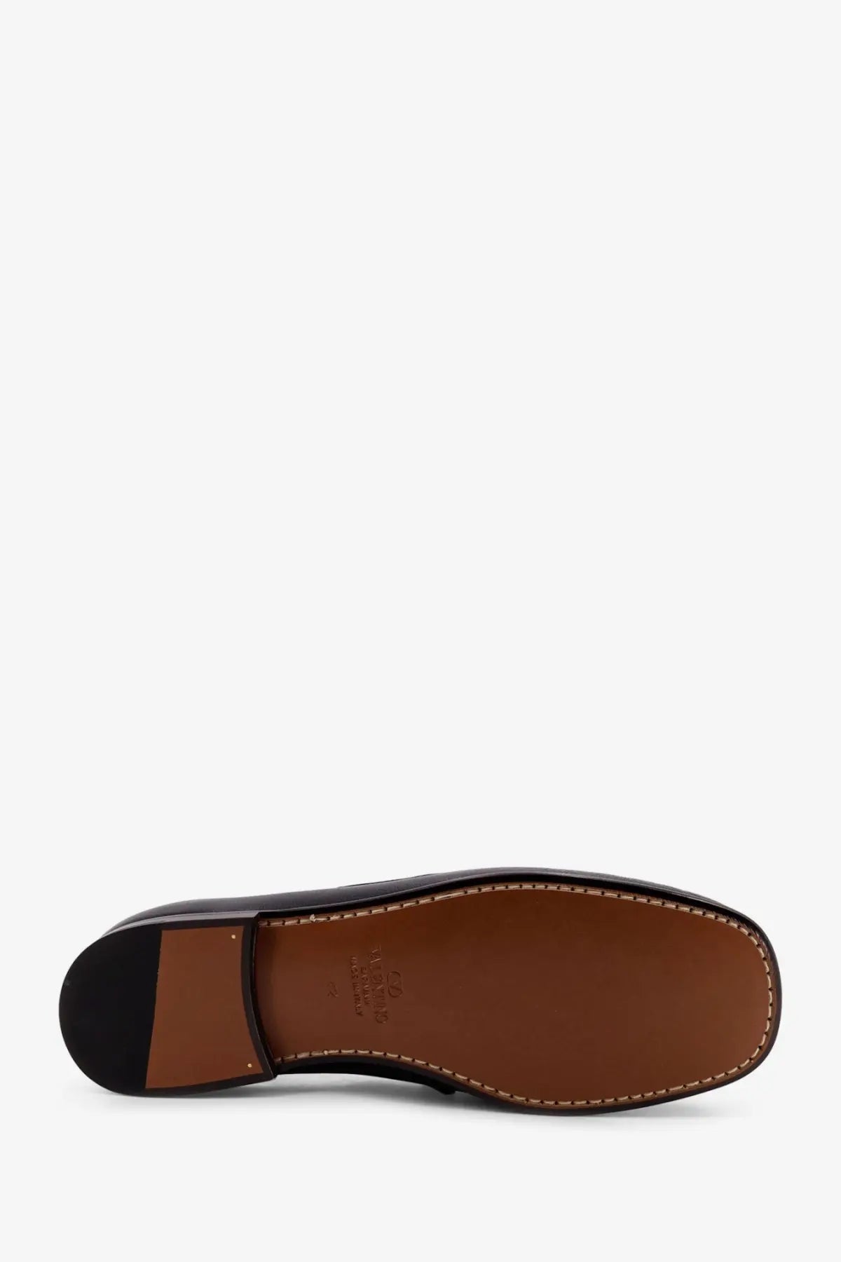 Black leather Valentino men’s loafer with brown insole and contrasting stitching for stylish comfort