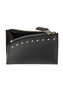 Valentino men’s rockstud card holder in black textured leather with silver-toned studs along the zipper line