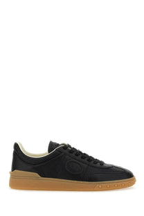 Valentino men’s Upvillage sneaker black leather with tan rubber sole and perforated detailing