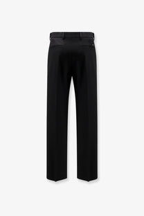 Black tailored valentino men’s virgin wool trousers with sleek straight-leg cut and subtle back pleats shown from the back