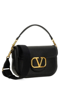 Valentino women’s alltime shoulder bag in black leather with gold-tone rockstud hardware and signature logo clasp