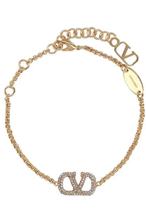 Valentino women’s gold-tone chain bracelet with crystal encrusted vlogo charm and engraved oval brand tag