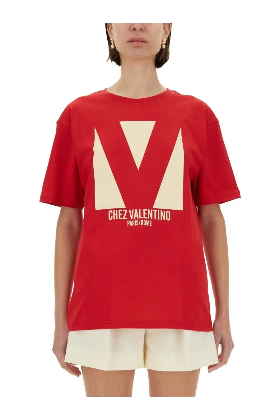 Valentino women’s red t-shirt with cream geometric v logo and chez valentino paris rome print on front