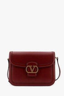 Valentino women’s leather shoulder bag brown in rich burgundy leather with gold-tone vlogo clasp and matching strap