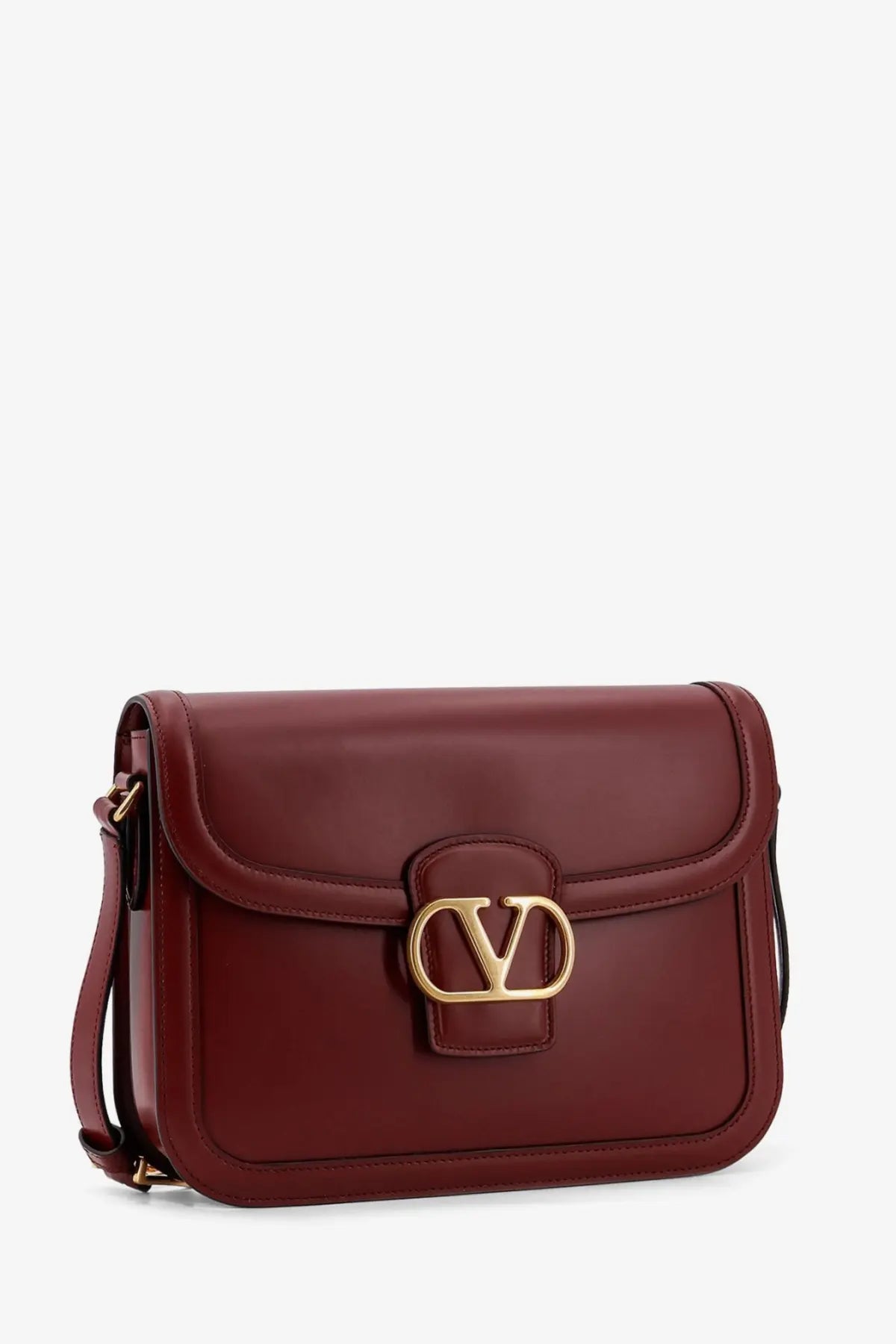 Valentino women’s leather shoulder bag in rich burgundy with gold-tone vlogo clasp and adjustable crossbody strap