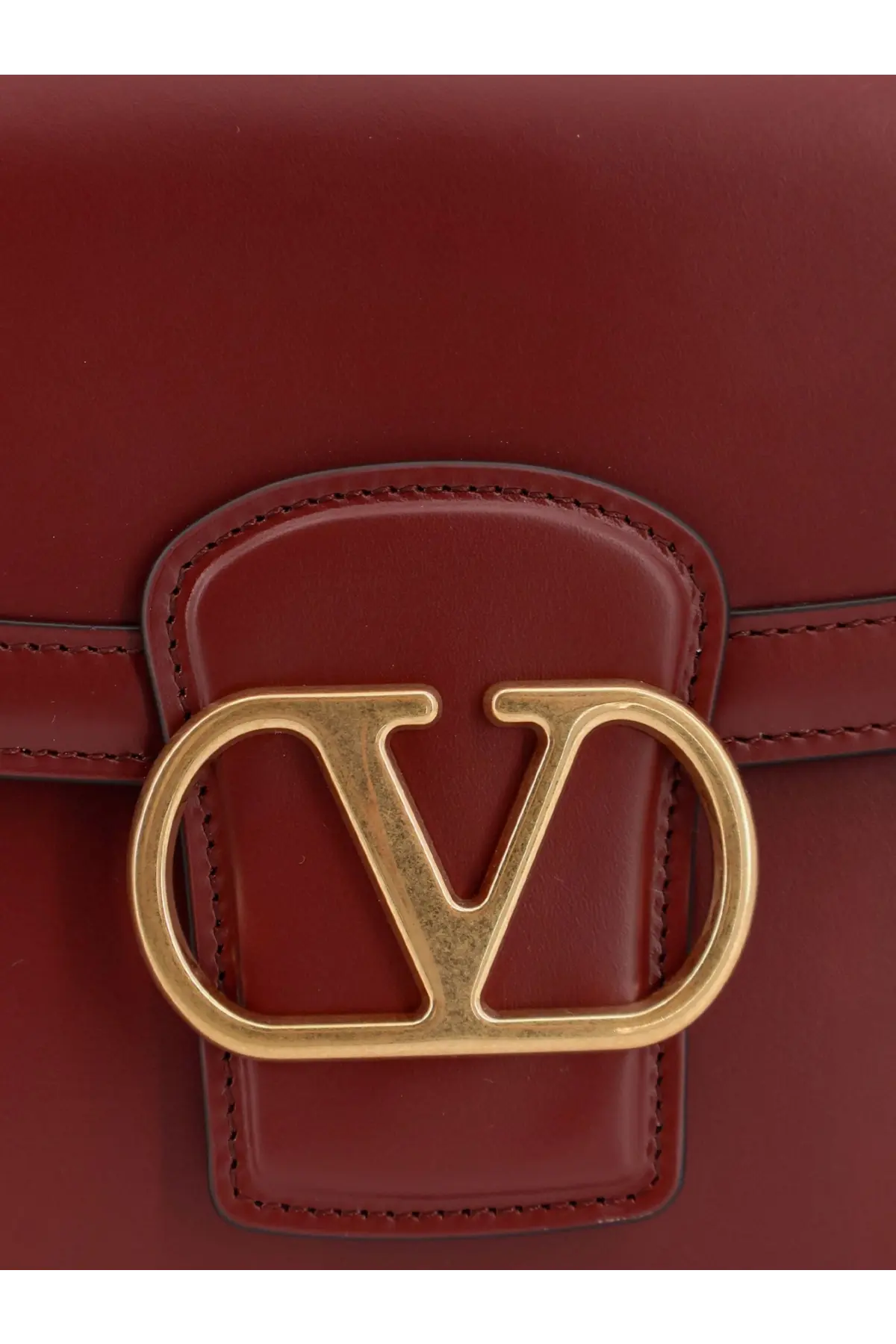 Valentino women’s leather shoulder bag in rich burgundy with a gold-tone Valentino logo clasp