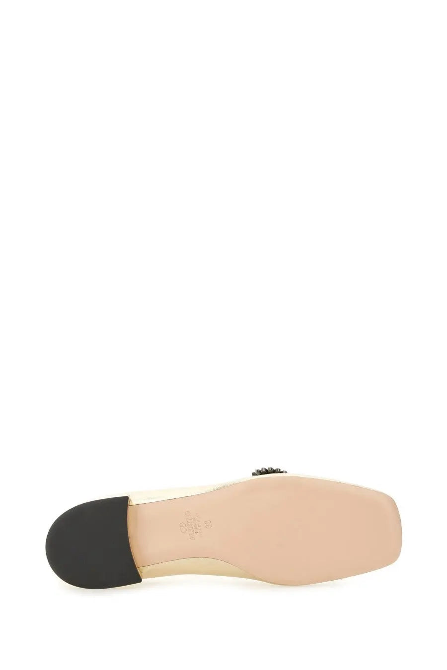 Beige leather mule shoe with black rubber heel and decorative embellishment near the back by valentino