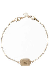 Valentino women’s gold-toned ovalette chain bracelet with engraved oval plaque and pearl accent at clasp