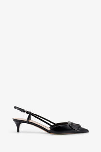 Valentino women’s black patent leather slingback pump with pointed toe and metallic buckle detail