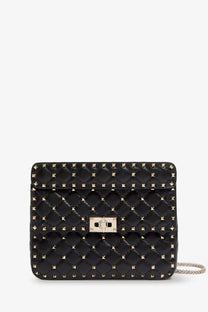 Valentino women’s black quilted leather crossbody bag with gold-tone studs and silver-toned clasp