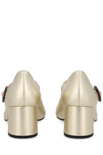 Valentino women’s gold metallic pumps with block heel and decorative floral embellishments on the side