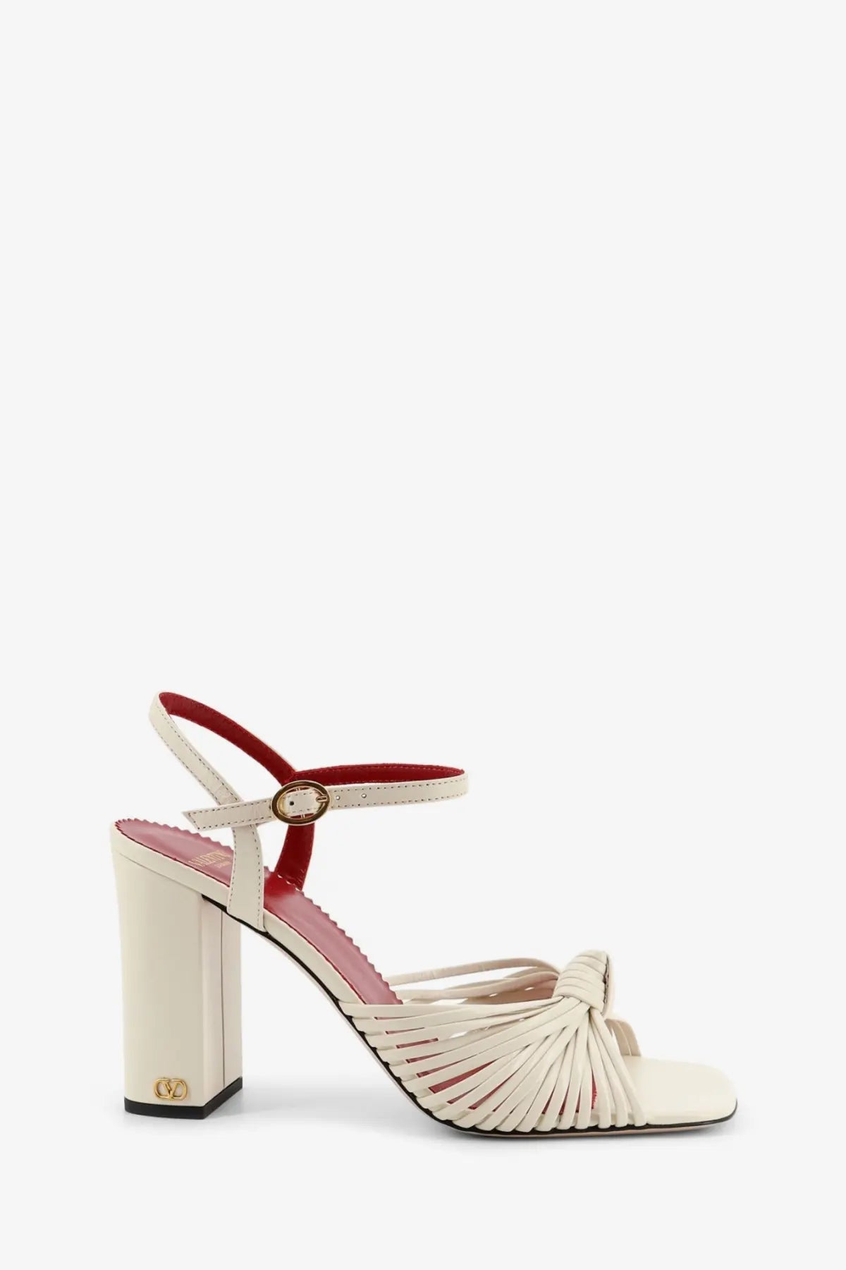 Cream-colored Valentino women’s VG Annet leather sandals with a red ankle strap gold-tone buckle and woven toe design