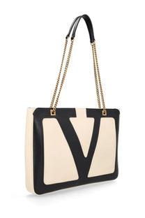 Valentino women’s viva superstar tote bag in black and cream leather with gold-tone chain straps and oversized v logo