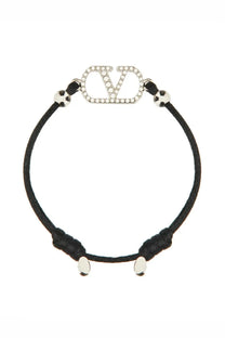 Valentino women’s black cord bracelet with silver vlogo charm encrusted with clear crystals and metallic sphere accents