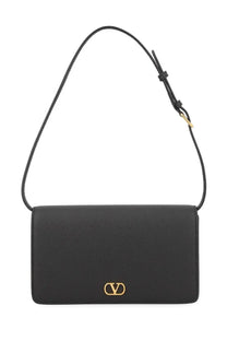 Black leather Valentino women’s Vlogo signature mini crossbody bag with gold-tone logo clasp