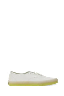 Vans men’s authentic sneaker white canvas with a translucent lime green rubber sole side view