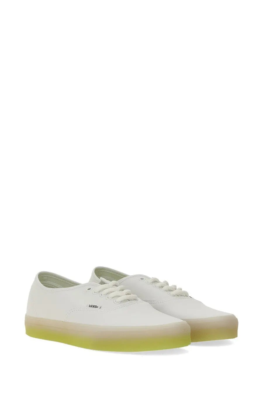 Vans men’s authentic sneaker white canvas with a translucent lime green rubber sole front view