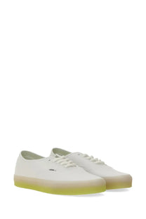 Vans men’s authentic sneaker white canvas with a translucent lime green rubber sole front view