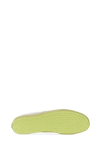 A lime green rubber sole with diamond tread on the back of vans men’s authentic sneaker white