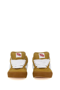 Pair of mustard-colored Vans men’s Knu Mid high-top sneakers with white laces and matching gum rubber sole