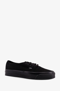 Vans men’s LX Authentic Reissue canvas sneakers in black with rubber sole and Vans logo on the side
