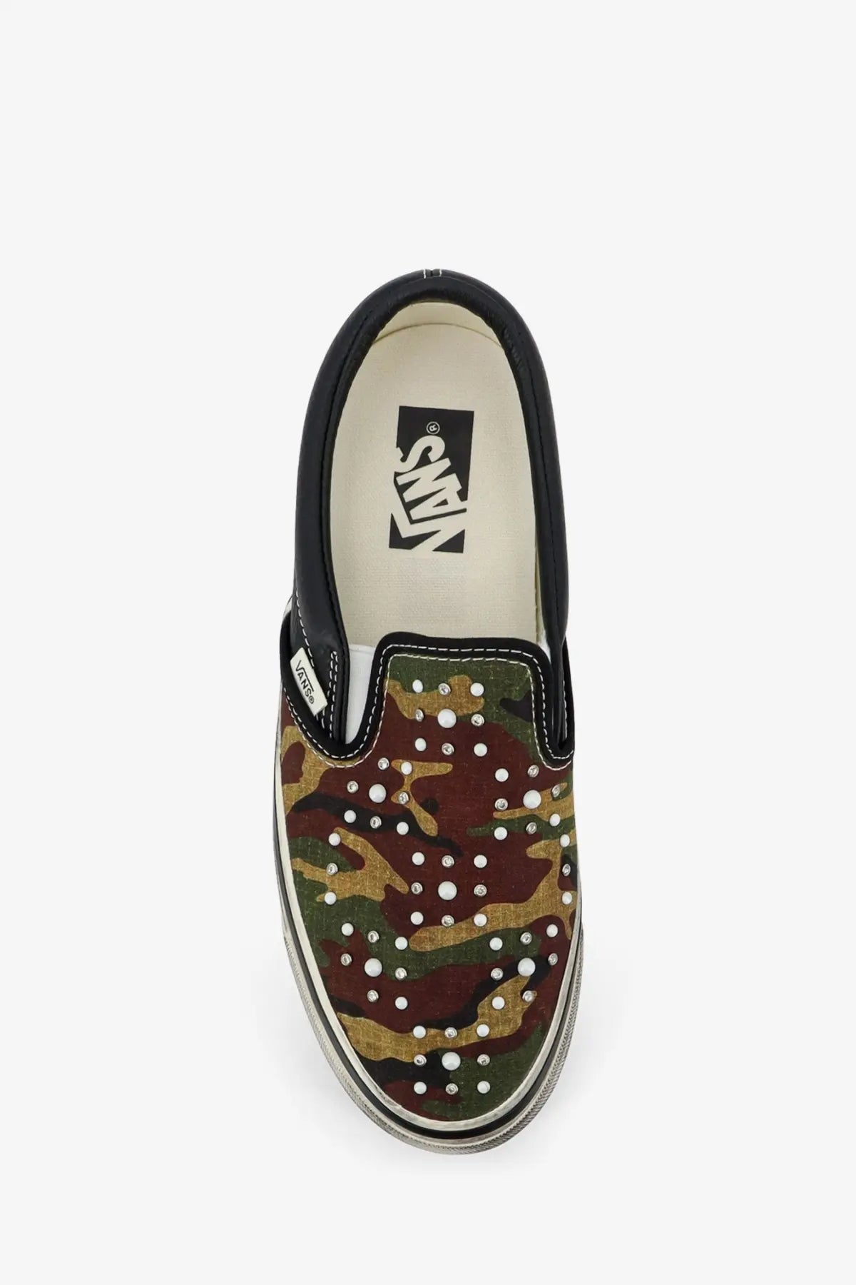Vans men’s LX classic slip on canvas and leather sneaker in black with camouflage pattern and white rhinestone accents