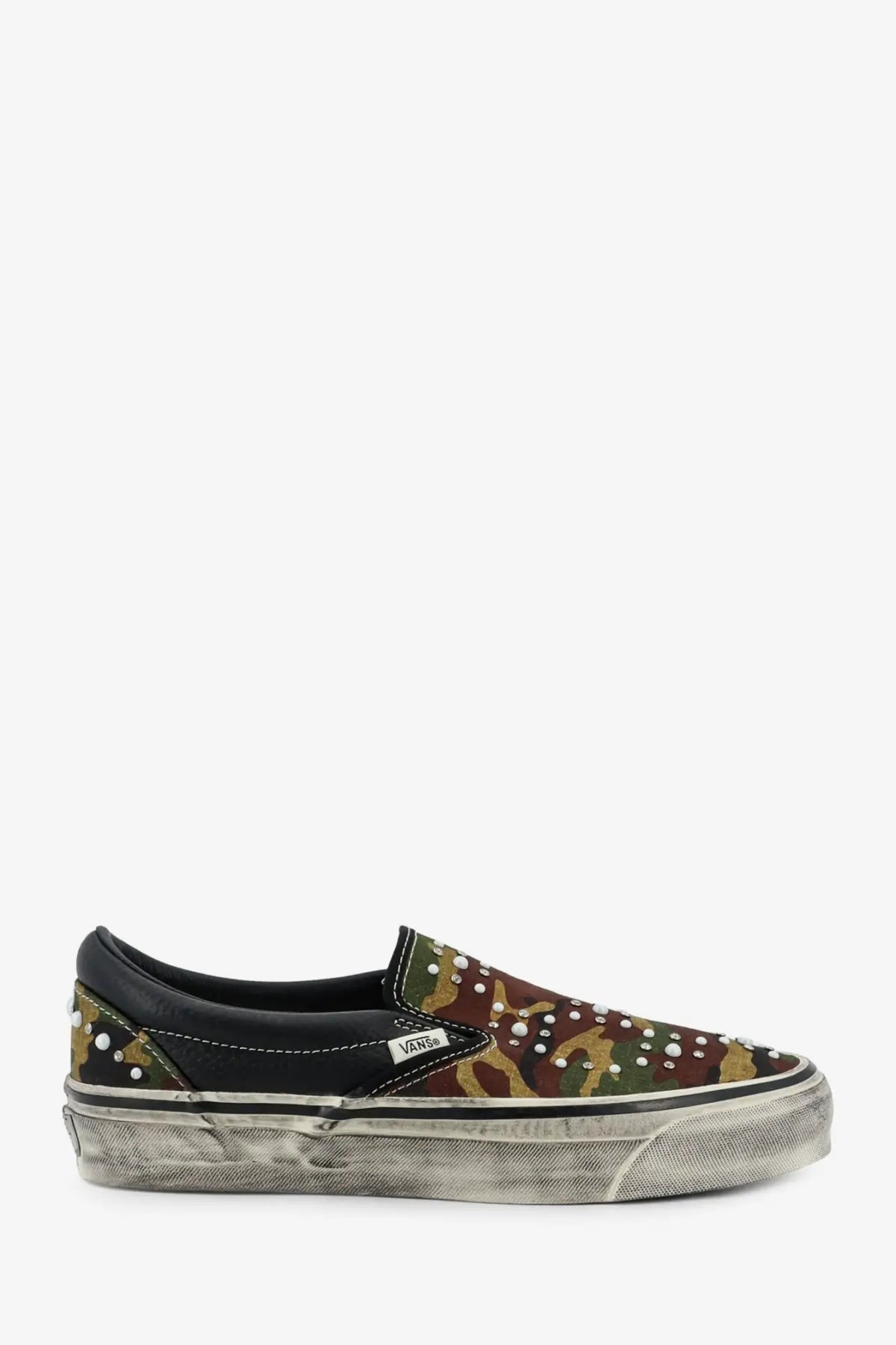 Vans men’s LX classic slip on canvas and leather sneaker in black with camouflage pattern white studs and distressed sole