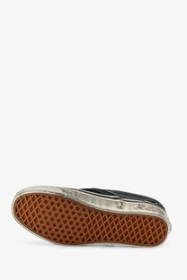 Vans men’s lx classic slip on canvas and leather sneaker in black with worn-out rubber sole and white stitching