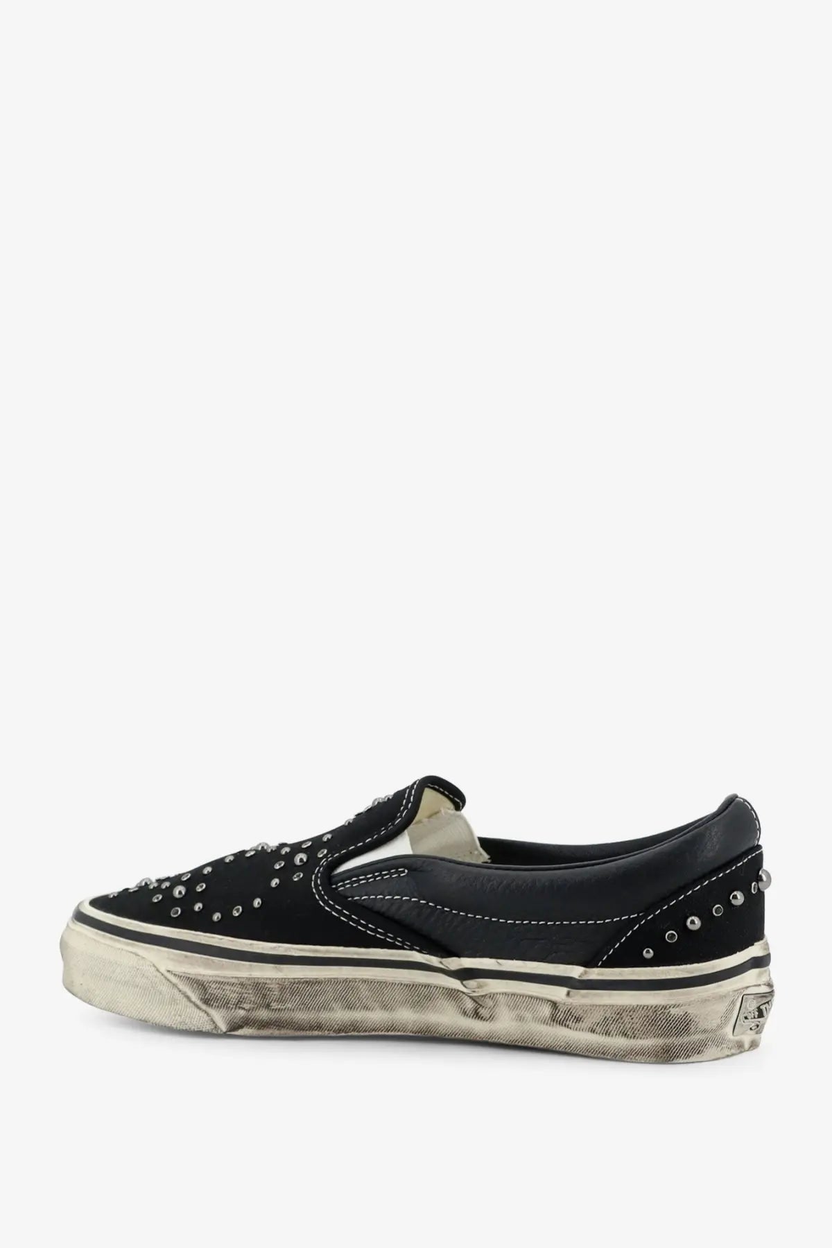 Vans men’s lx classic slip-on sneaker in black suede with silver studs and a distressed white rubber sole