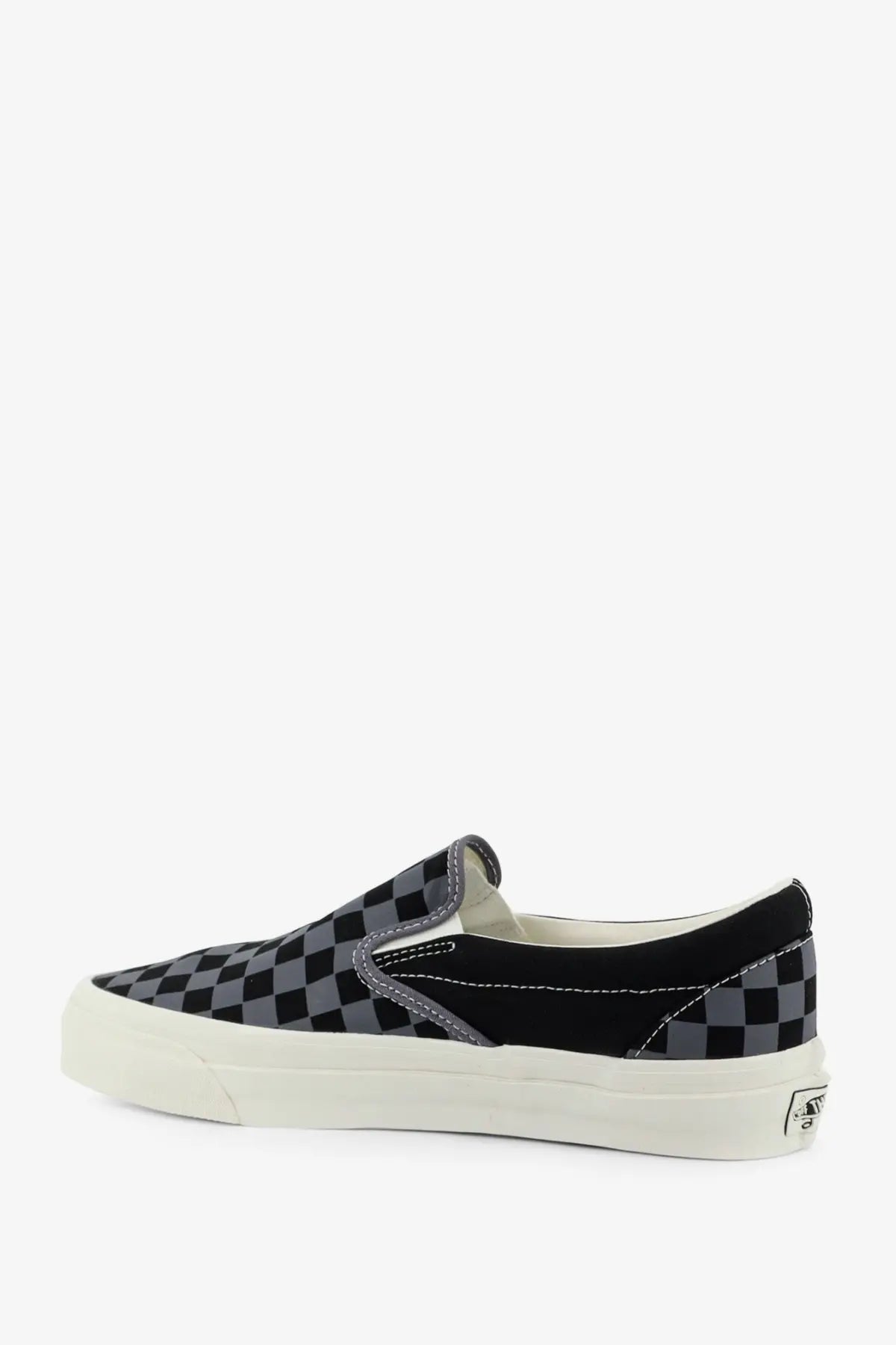 Vans men’s lx classic slip on canvas sneaker in black and gray checkerboard with white rubber sole