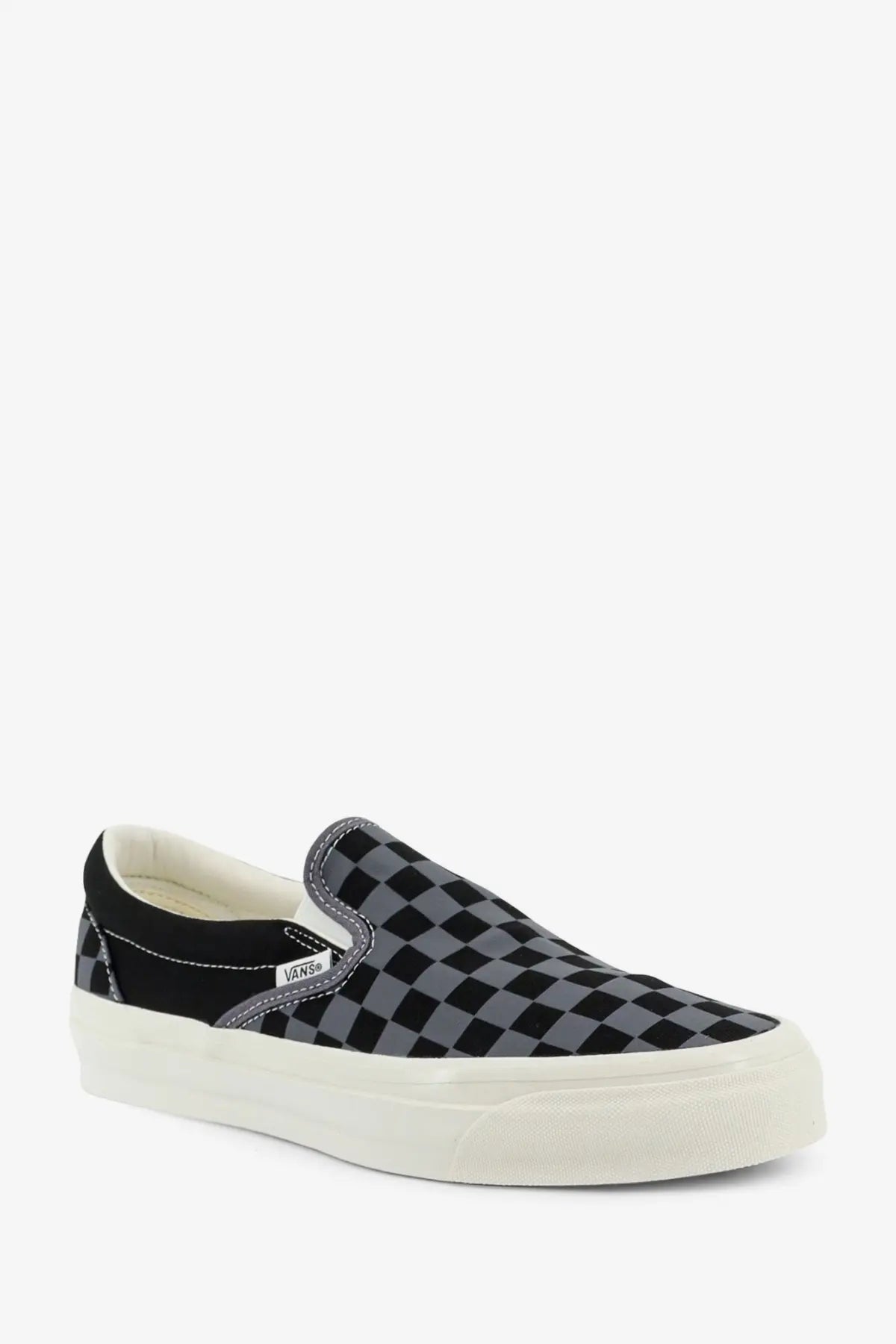Vans men’s LX classic slip-on canvas sneaker in black and gray checkerboard pattern with white rubber sole