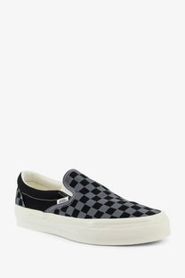 Vans men’s LX classic slip-on canvas sneaker in black and gray checkerboard pattern with white rubber sole