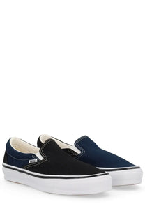 Vans men’s slip-on sneakers in black and navy blue with white rubber soles and contrasting stitching from Engineered Garments multicolor collection