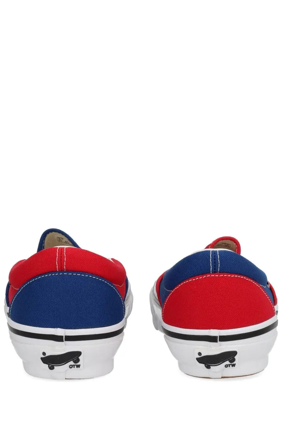 Red and blue canvas slip-on vans men’s sneaker with white rubber soles black stitching and skateboard logo on heel back side