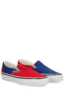 Vans men’s slip-on sneakers multicolor with red and blue canvas, white rubber soles, and black stitching
