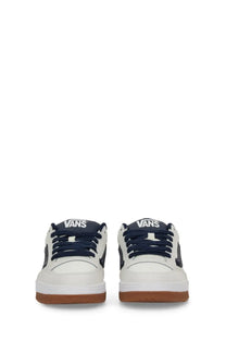 Vans men’s sneaker Hylane white featuring white canvas with navy blue laces and side panels and gum rubber sole