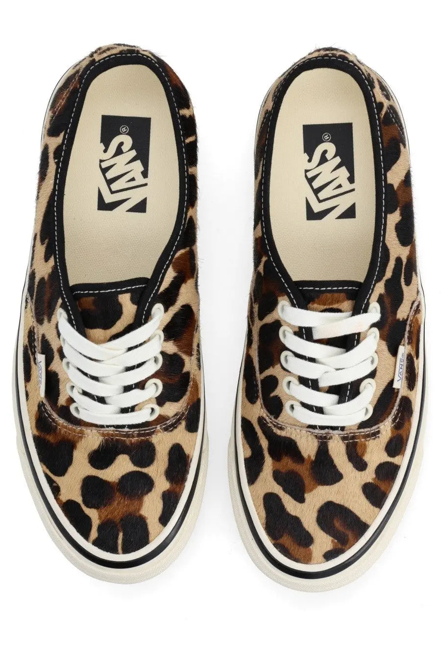 Vans unisex sneaker authentic leopard print canvas with white laces and black rubber soles visible from the back side