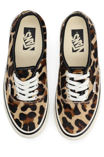 Vans unisex sneaker authentic leopard print canvas with white laces and black rubber soles visible from the back side