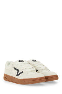 Cream-colored Vans unisex Upland sneaker with bold black v logo and gum rubber soles in a casual design