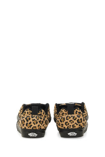 Leopard-print vans women’s knu school slip-on sneakers with black rubber soles and matching heel tabs