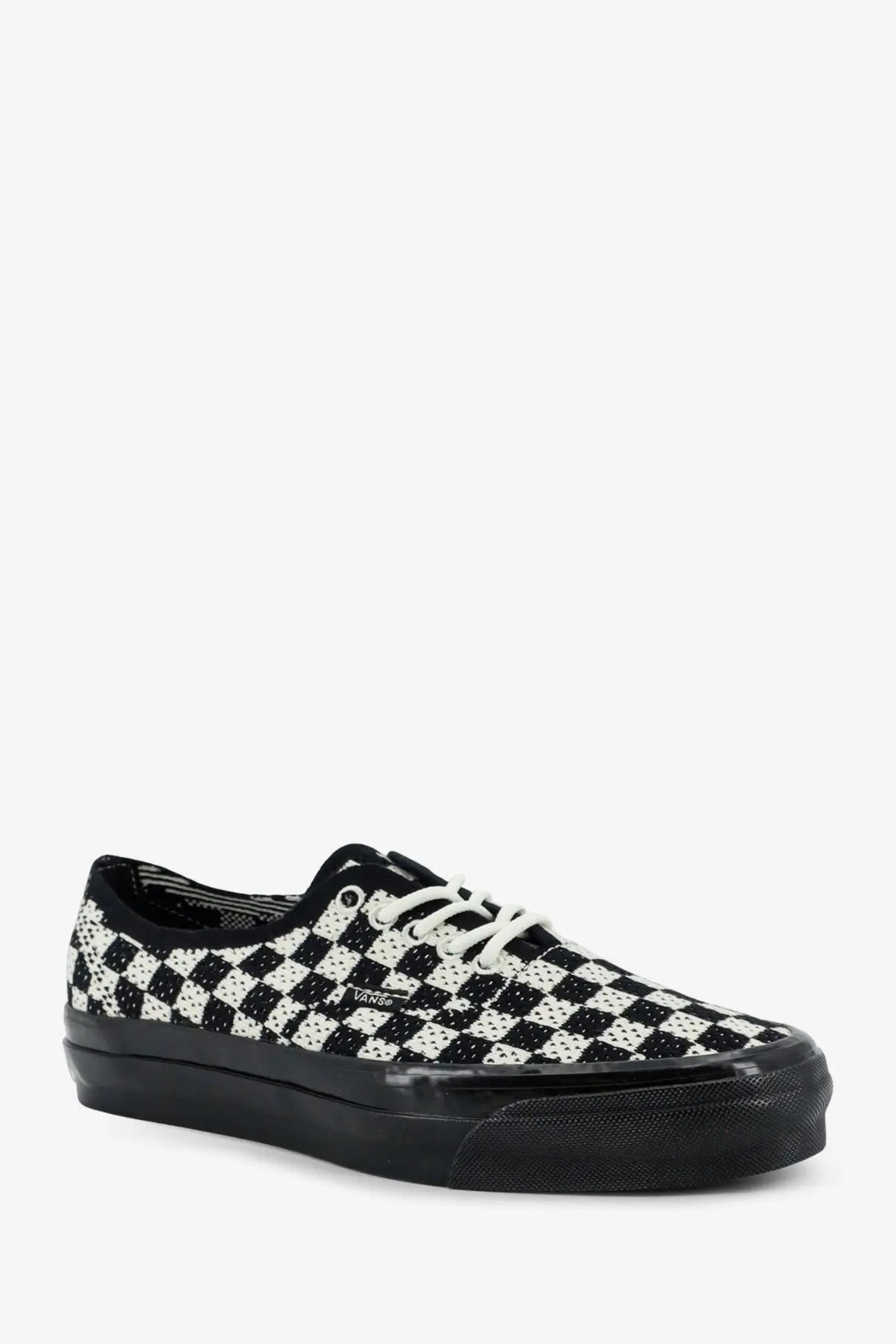 Vans women’s lx authentic fabric sneaker in black with black and white checkerboard pattern and glossy black rubber sole