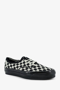 Vans women’s lx authentic fabric sneaker in black with black and white checkerboard pattern and glossy black rubber sole
