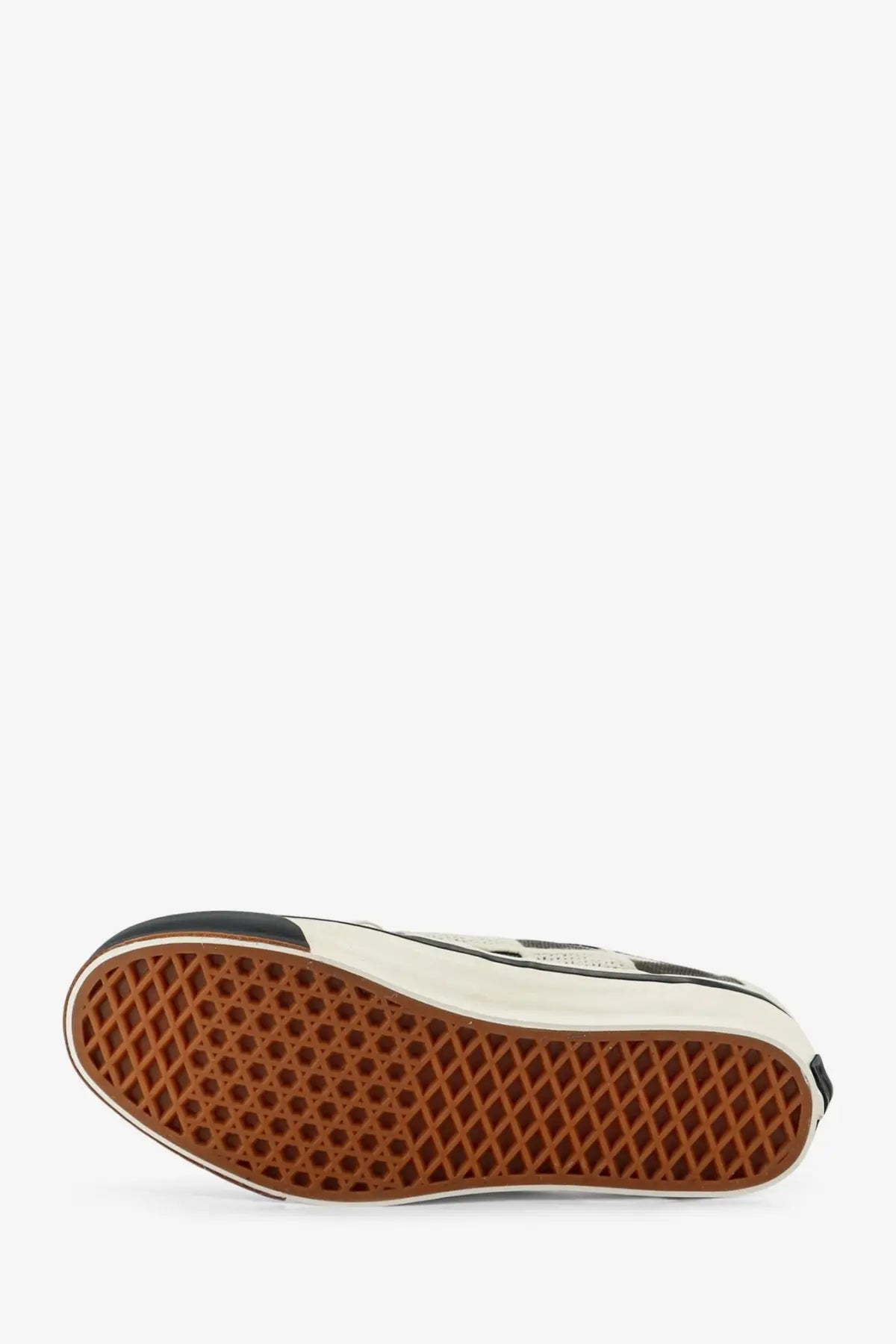 Vans women’s lx authentic sneaker in black with white accents and a brown waffle rubber sole shown from the back
