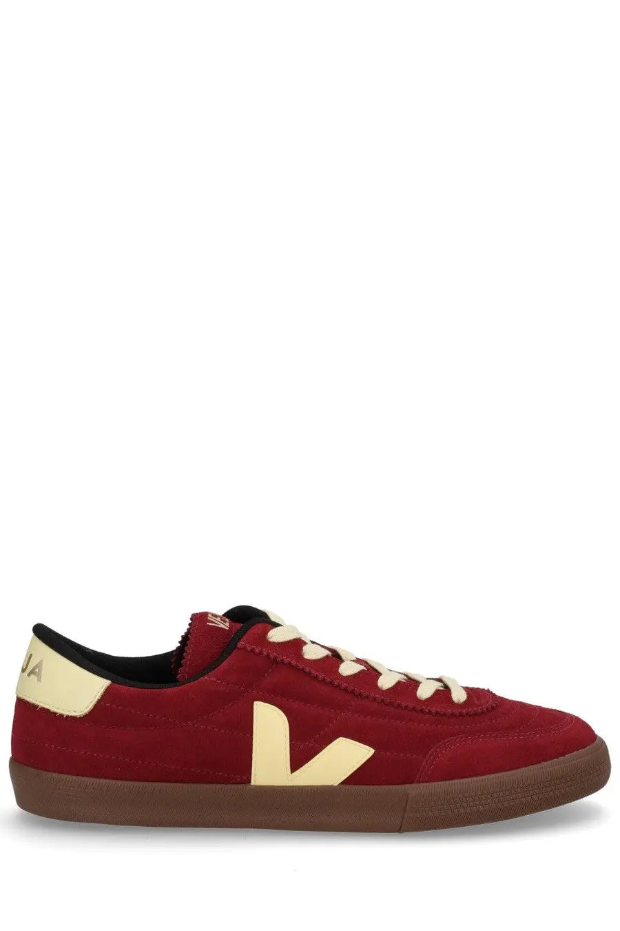 Veja men’s panenka sneaker red is a red suede low-top sneaker with a cream v-shaped logo and brown rubber sole