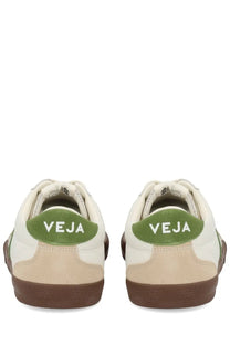 Veja men’s volley sneaker in white and beige with green suede heel tabs featuring the brand name at the back
