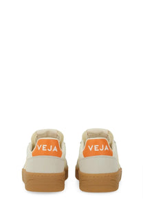 Veja unisex sneaker multicolor cream canvas with orange heel tabs featuring the veja logo and tan rubber soles
