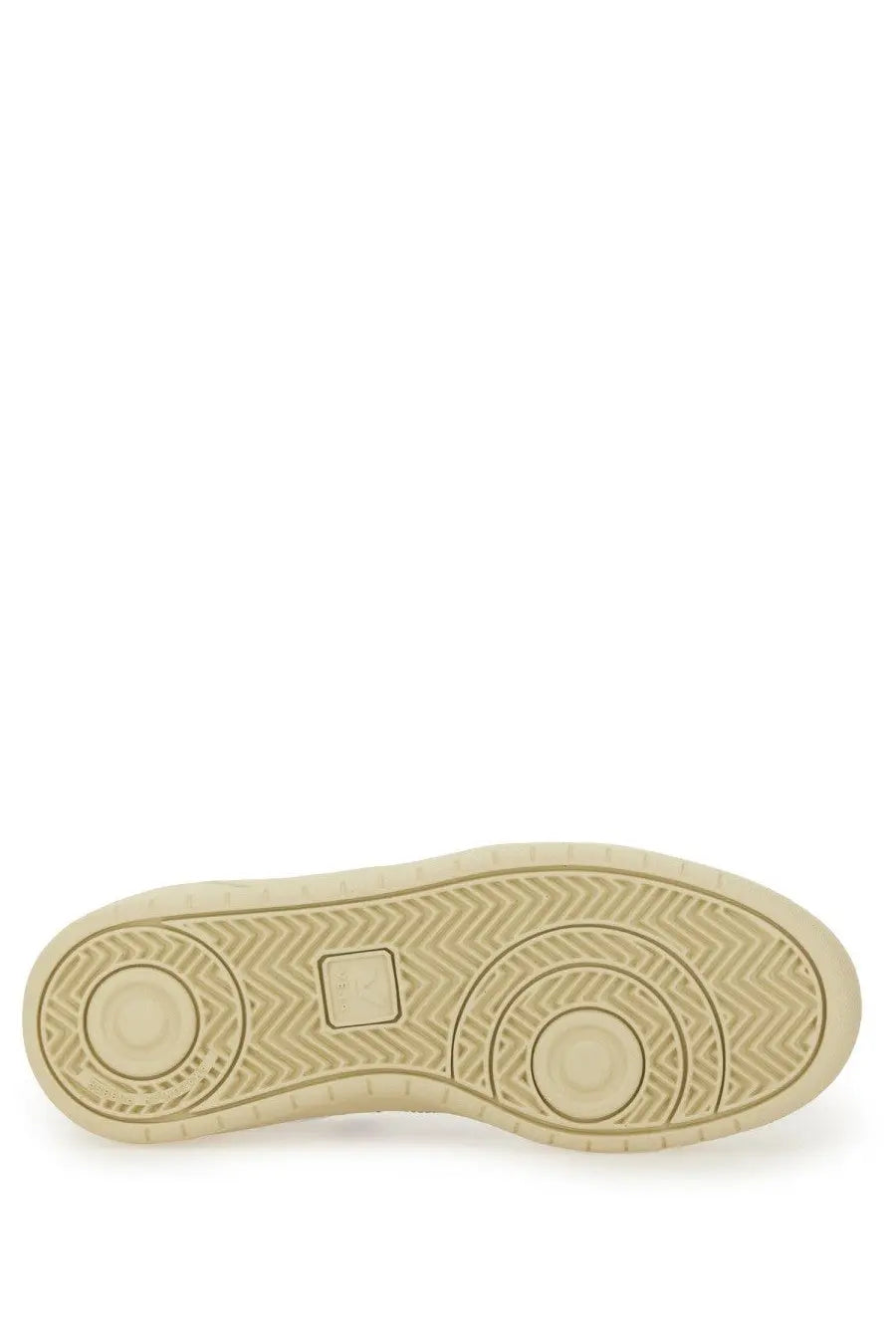 Beige rubber sole with herringbone tread and circular design elements on veja women’s sneaker white